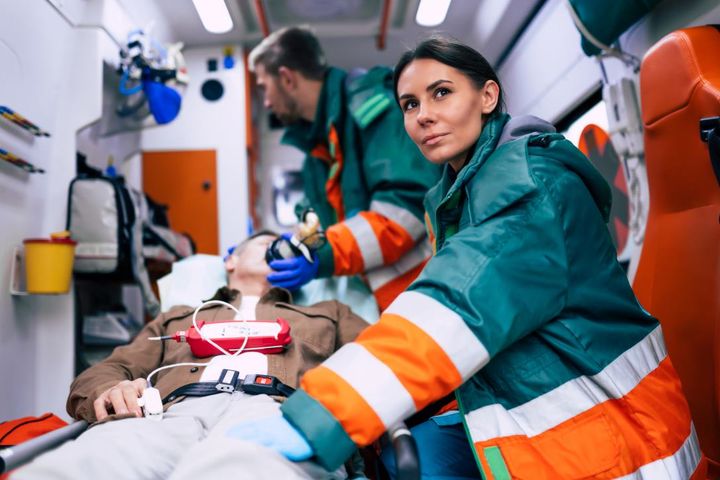 Flight nurse transporting patient