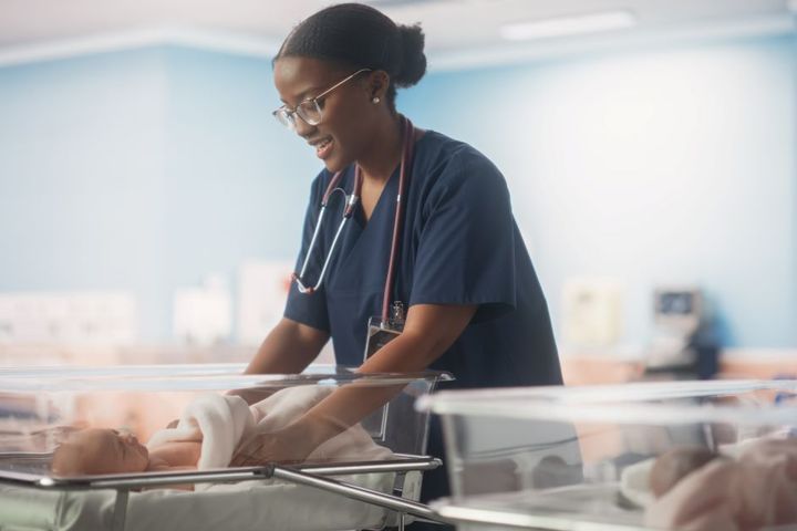 NICU nurse caring for newborn
