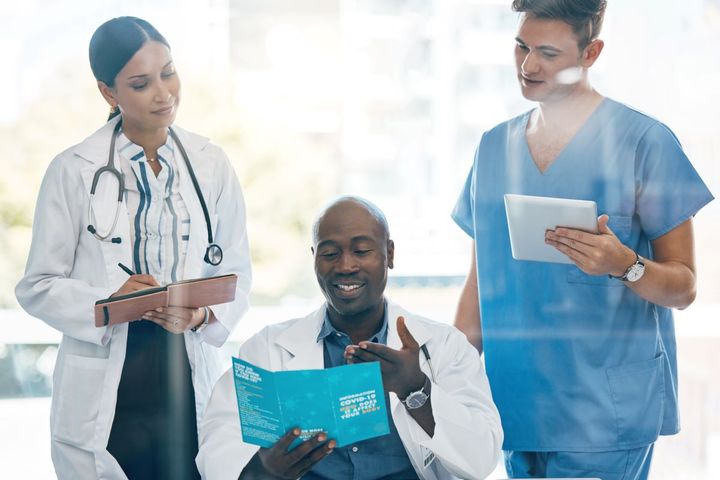A medical facility's CEO meets with managers.
