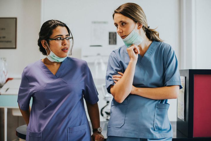Two nurses talking in a difficult situation.