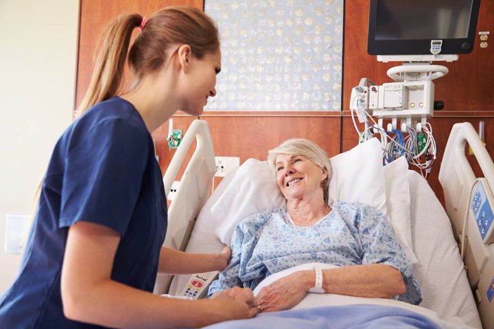 A nurse with CPAN certification assists a patient after an anesthesia procedure.