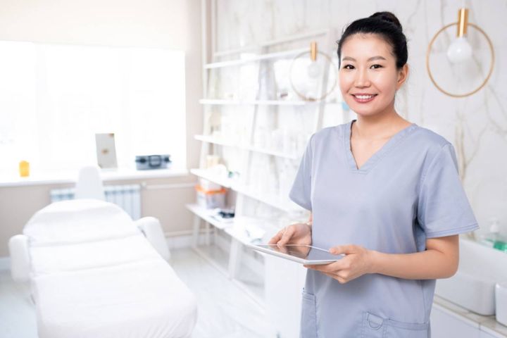 A nurse works on her dermatology nurse cover letter.