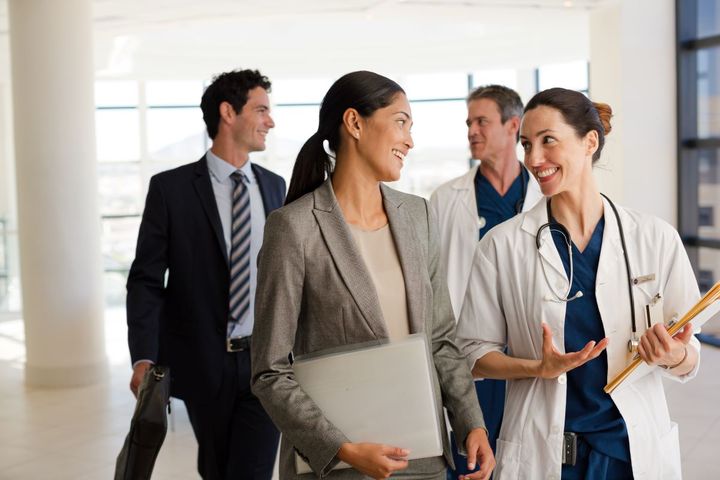 Group of professionals talking in a medical facility