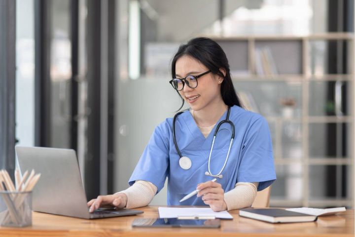 A nurse researches how to become a legal nurse consultant.