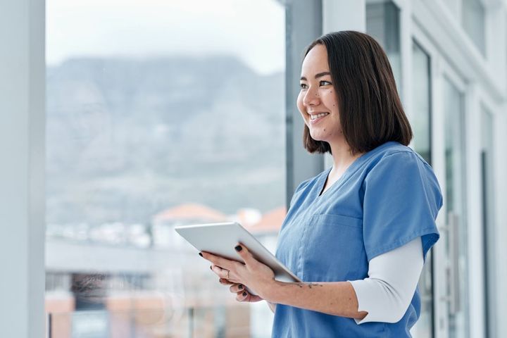 Nurse manager using tablet