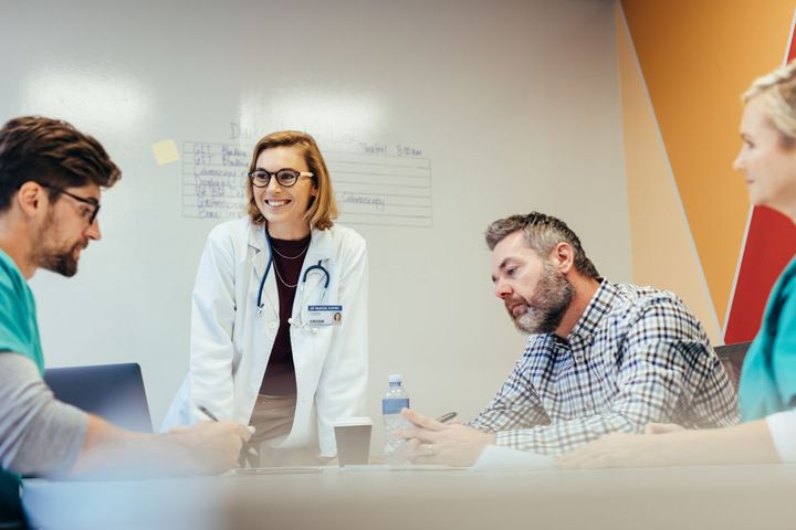 A team of healthcare professionals reviews MEAT criteria as they conduct an audit.