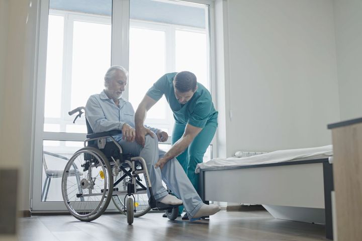 A nurse assesses a patient with dementia.