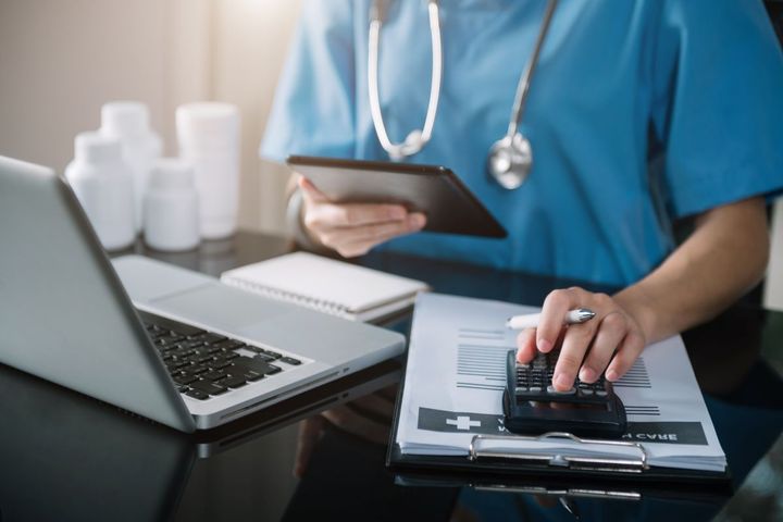 A nurse goes through and enters billing codes for services provided to a patient.