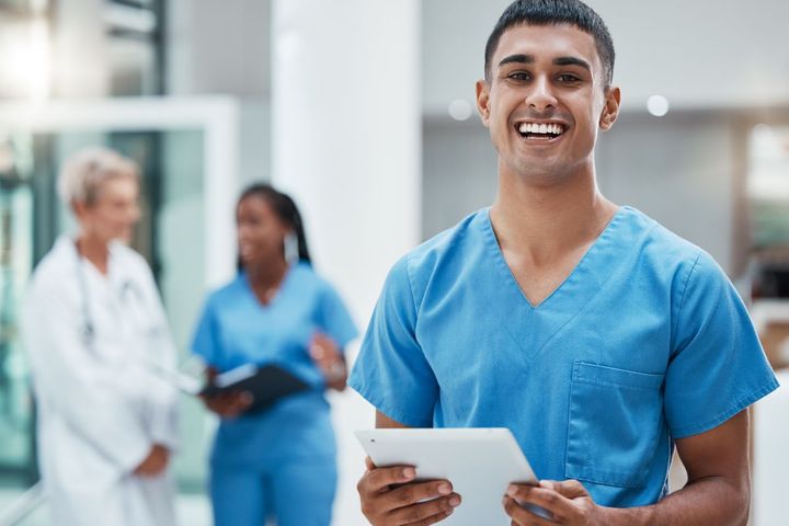 Nurse smiling with tablet