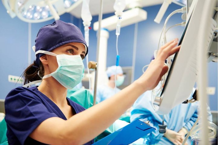 An OR nurse prepares for a surgical procedure.