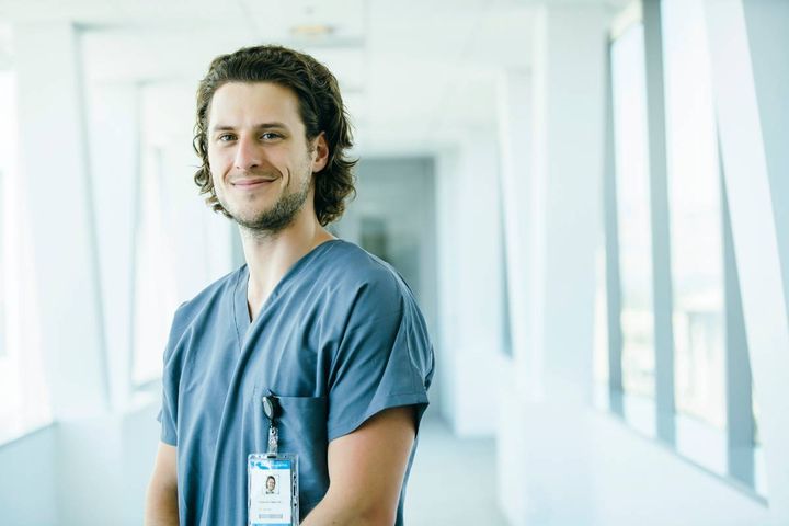 A substance abuse nurse stands in a hospital hallway.