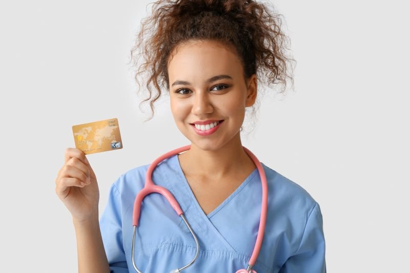 Image of a nurse holding a gift card for a recommended nurses week gift