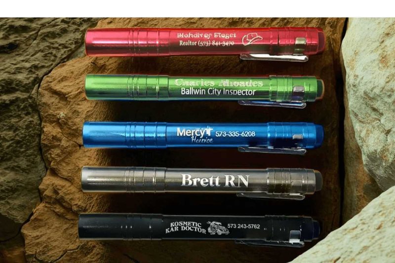 Customized pen lights with names on them.