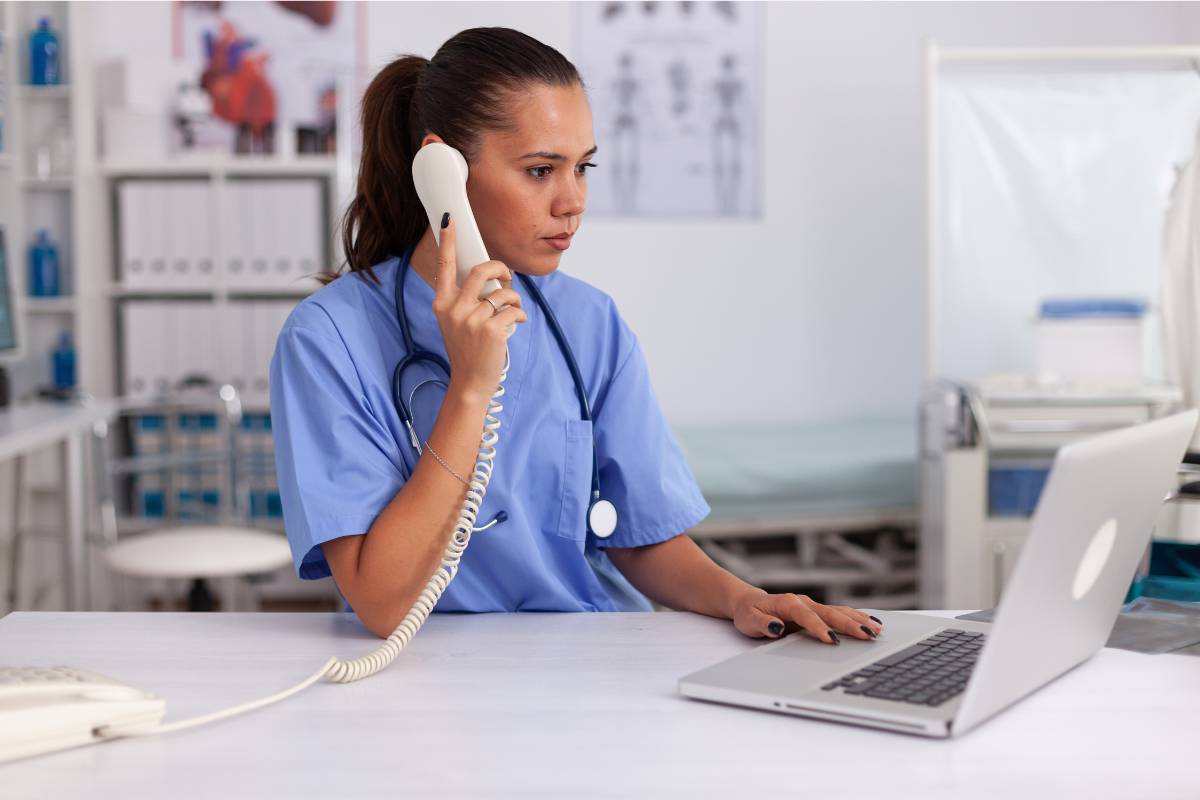 A nurse speaks on the phone about how to become an RN in Utah.