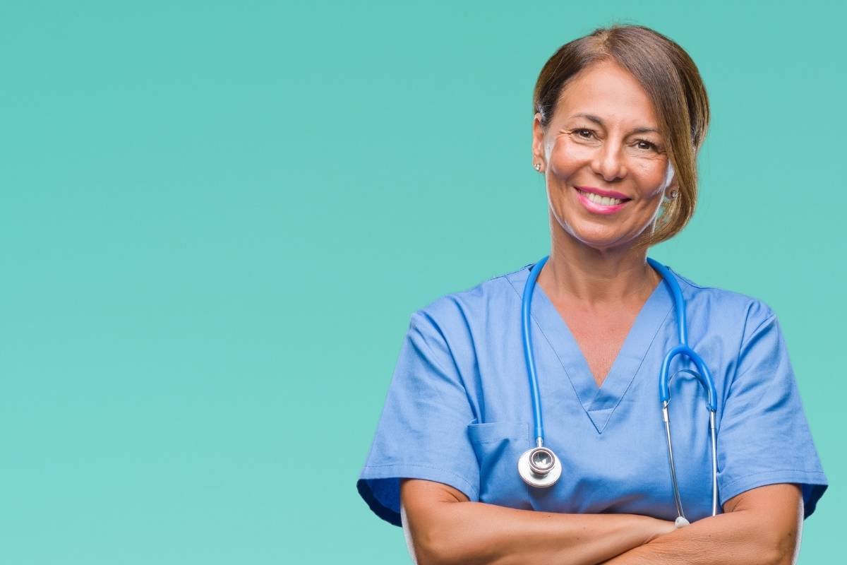 A nurse proudly uses her SRNA resume skills.