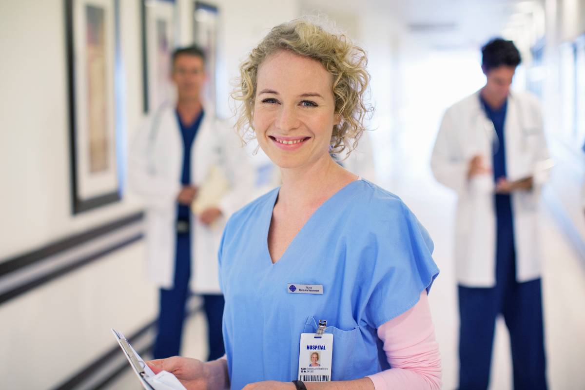 A nurse poses for a photo while discussing the mnemonic for ABC in nursing.