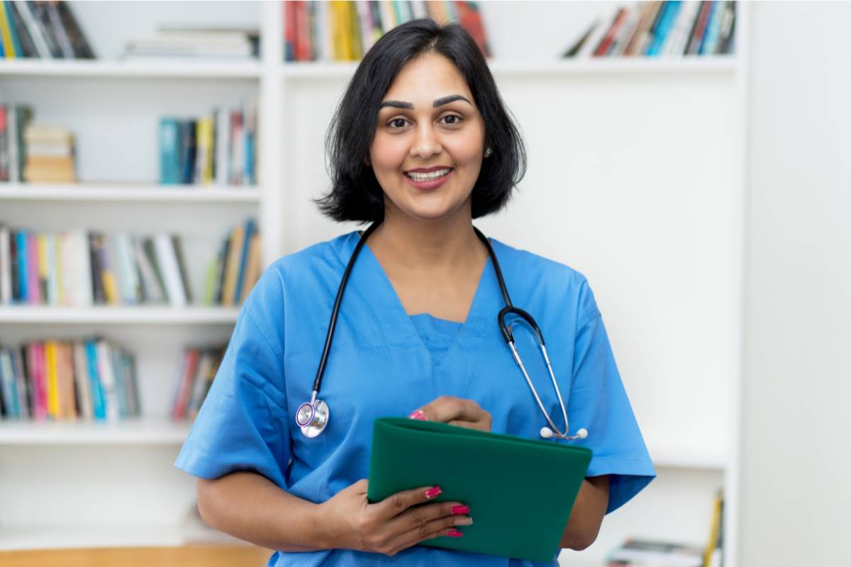 A nurse with CNE certification prepares to teach a nursing education class.