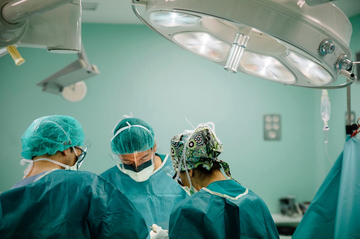 Surgeons working on a patient in the operating room.