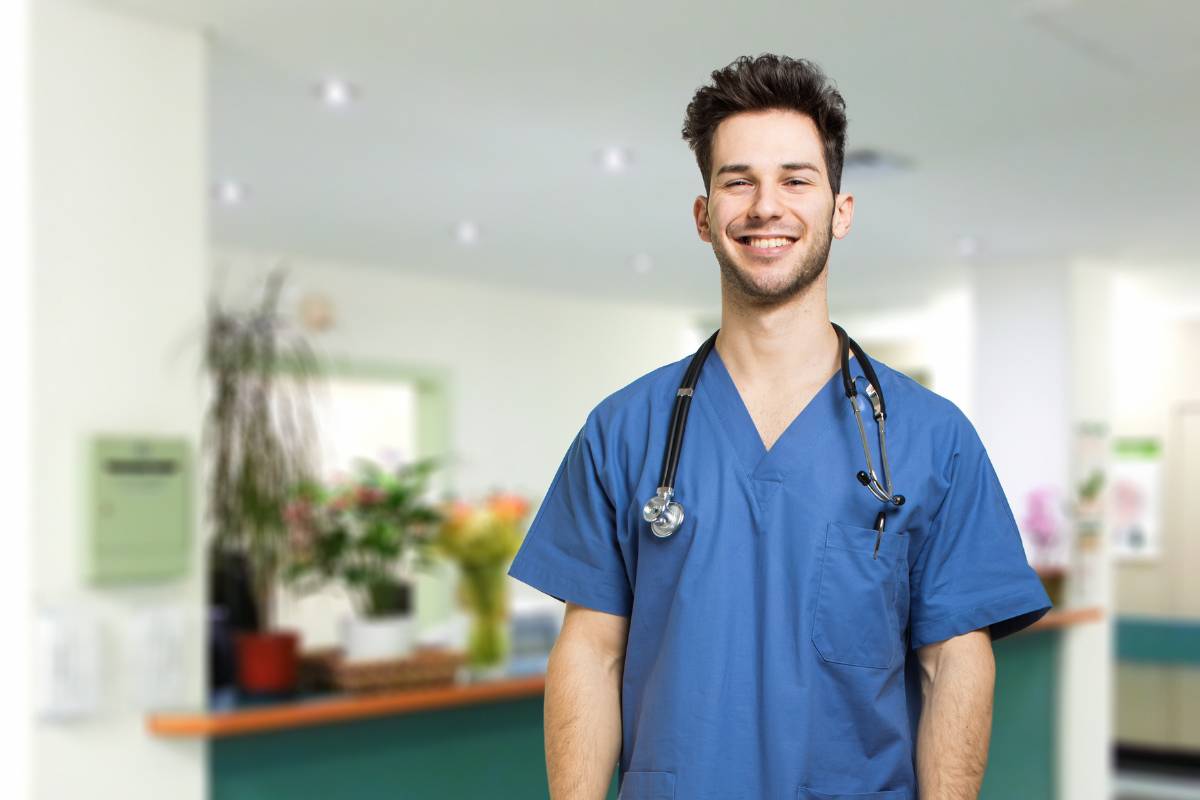A nurse poses for a photo while discussing how to become an RN in Colorado.