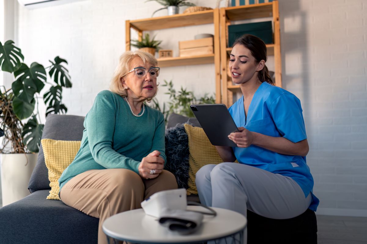 An MDS nurse checks in with a long-term care resident.