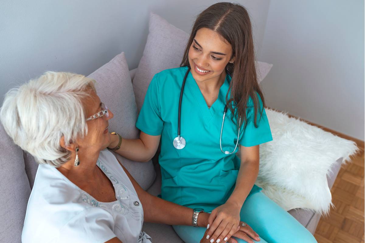 A nurse demonstrates nonmaleficence in practice as she weighs treatment options with a patient.