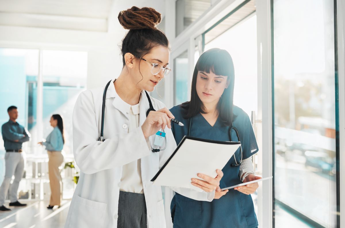 A nurse coach works with one of her new nurses.