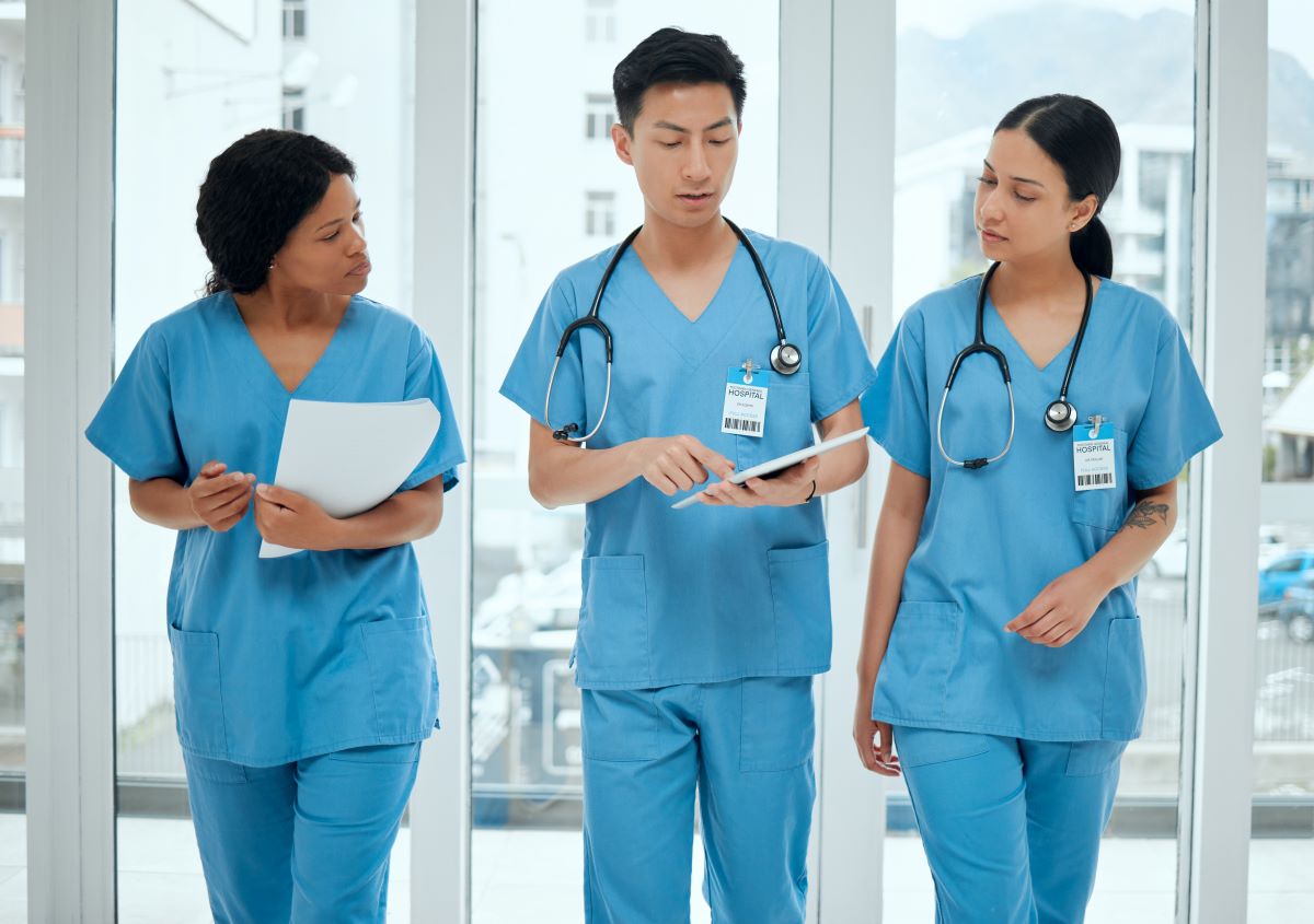 Group of nurses talking in a hallway