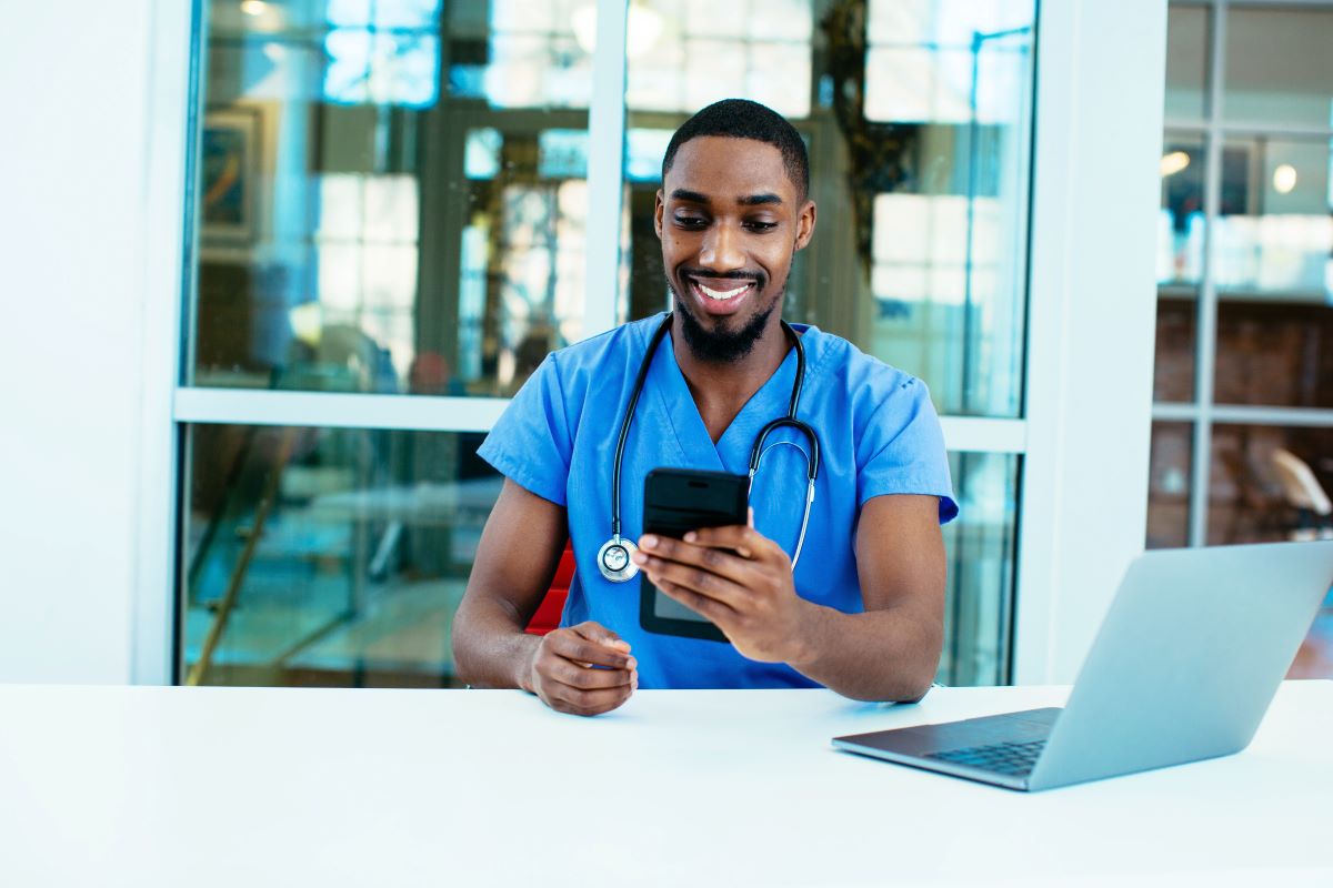 A nurse checks his messages after posting to a nursing job board.