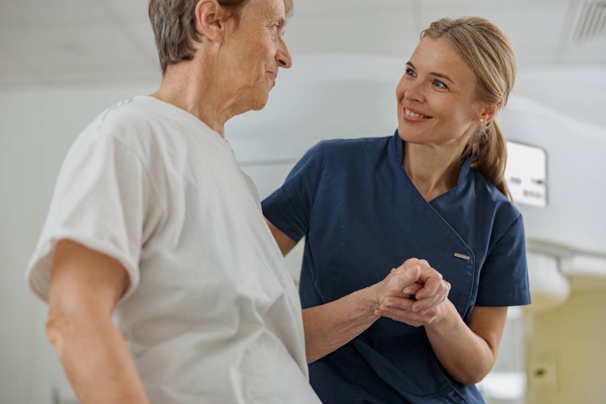 A nurse with OCN certification assists an oncology patient.