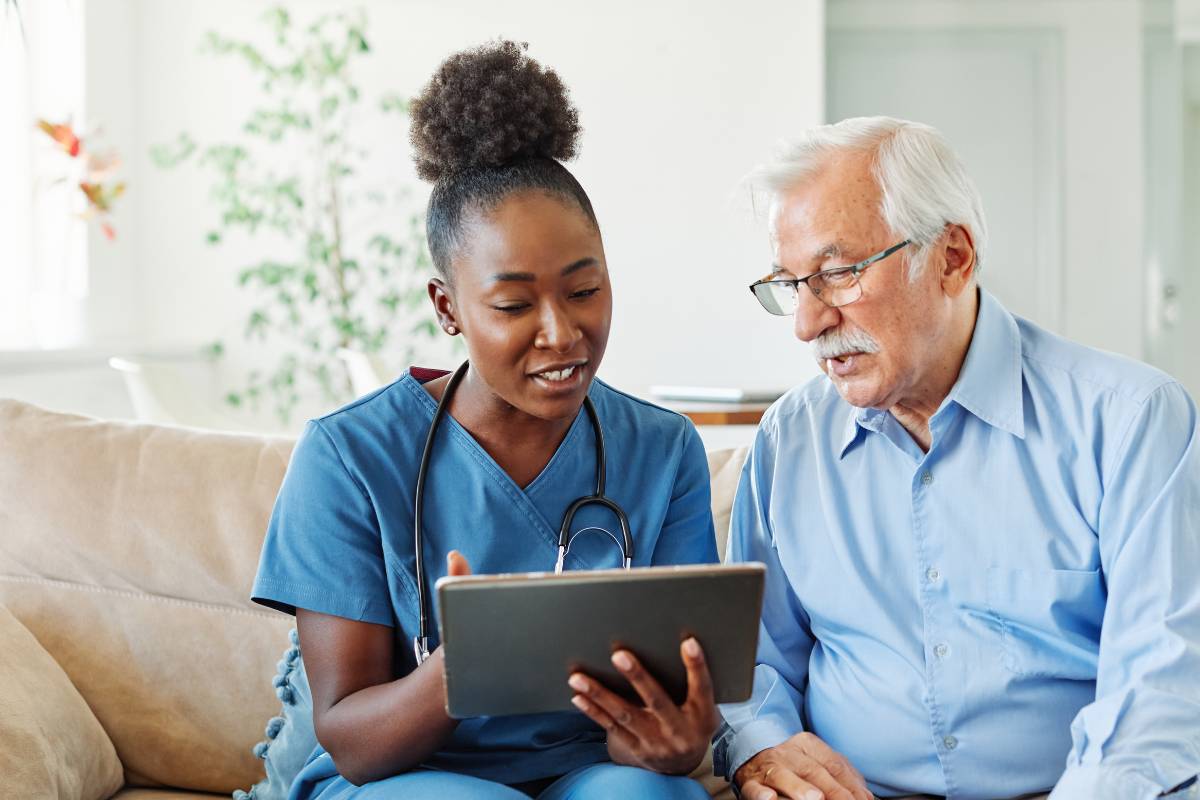 A patient care coordinator shows a patient their upcoming appointment schedule.