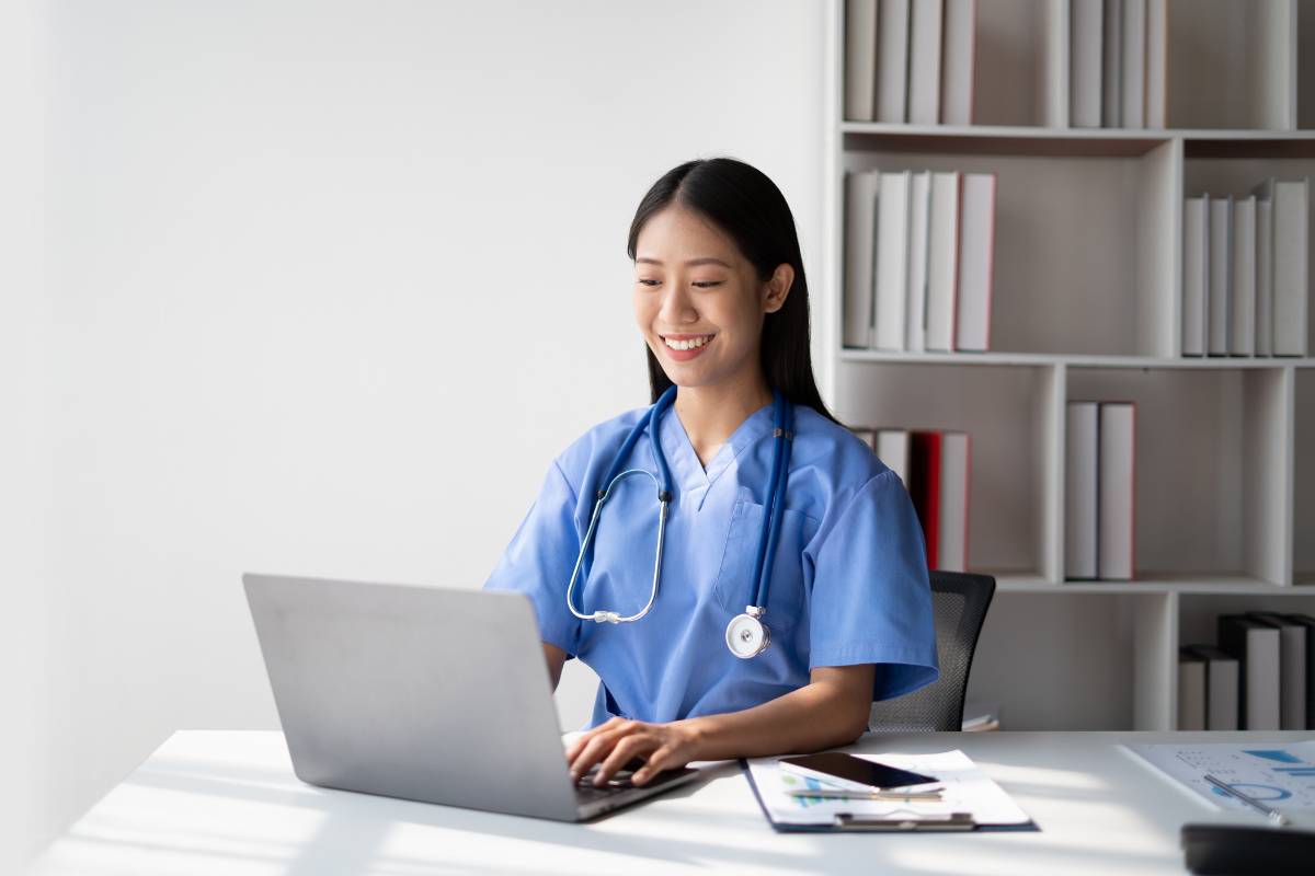 Student types their personal statement for nursing school.