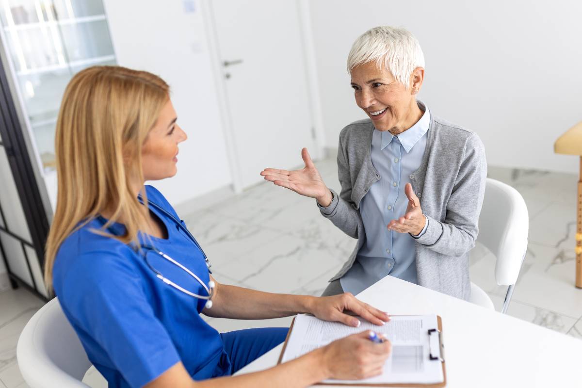 A nurse working in primary care nursing assesses a new patient.
