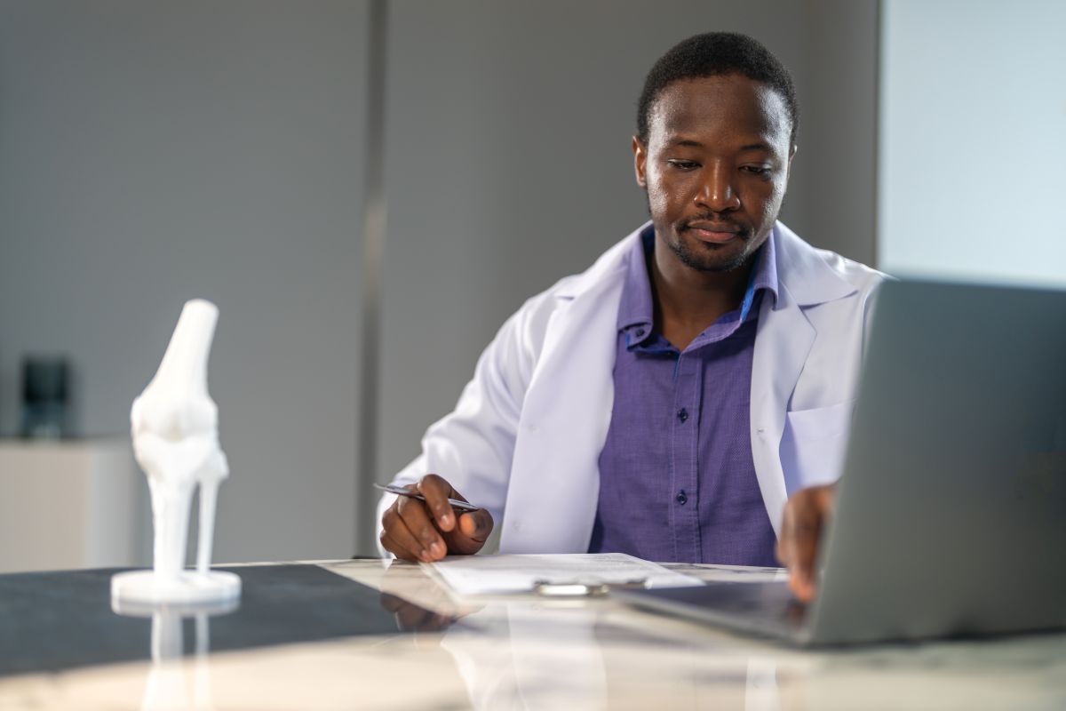 A physician reviews quality metrics.