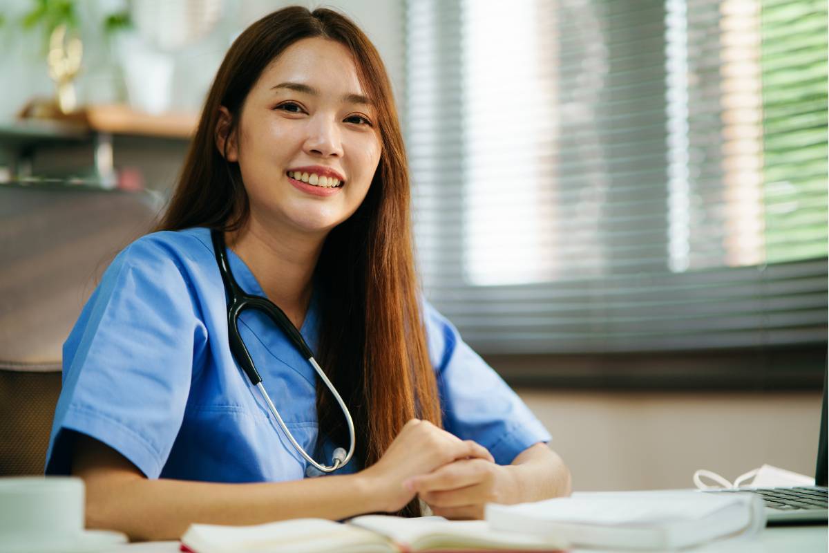 A nurse works on her RN refresher course homework to get relicensed in her state.