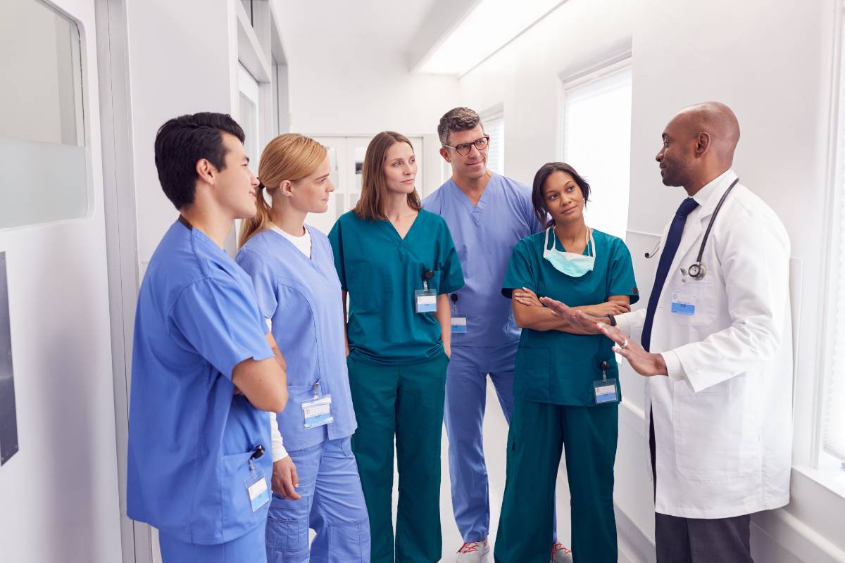A healthcare team discusses social justice in nursing.