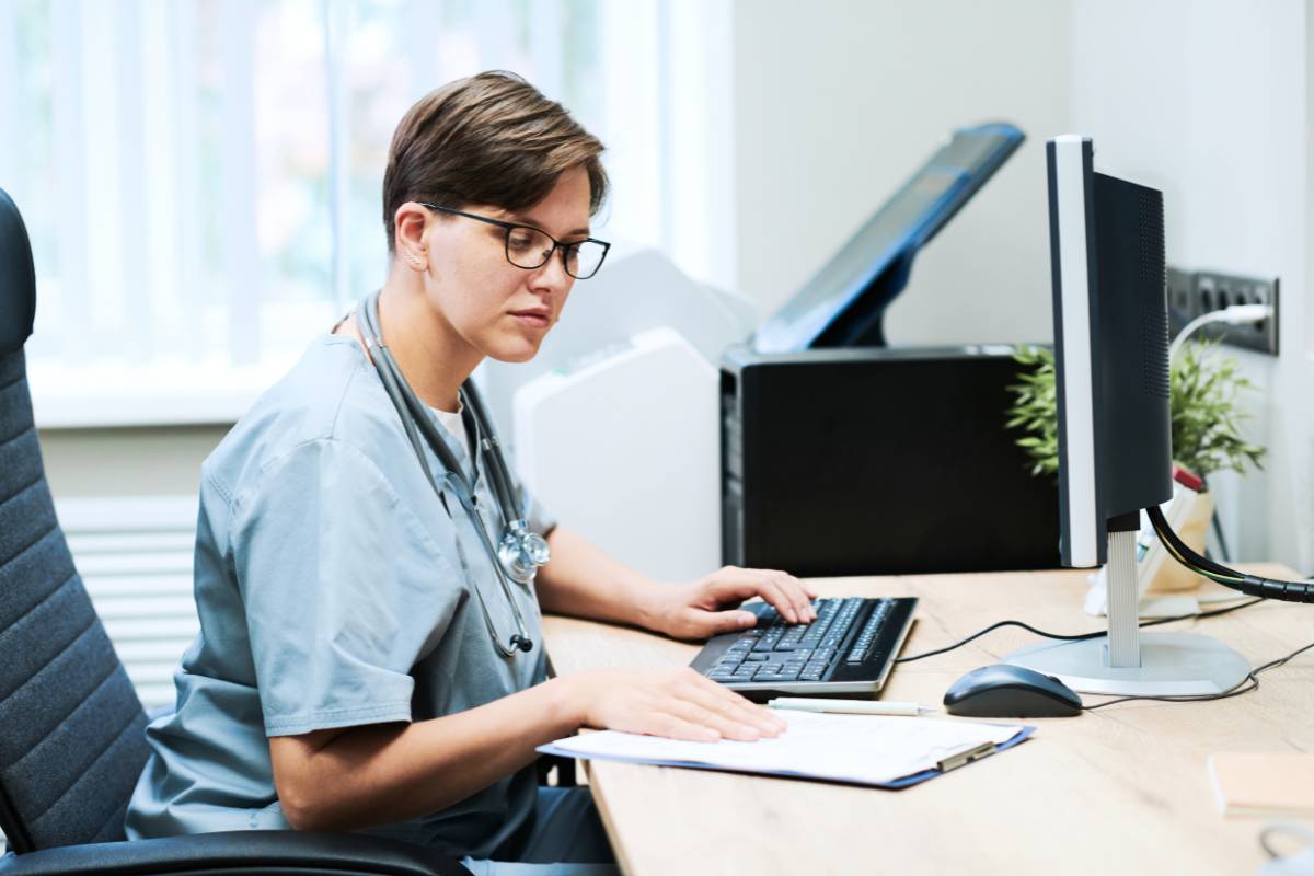 A nurse works on their South Carolina nursing license renewal.