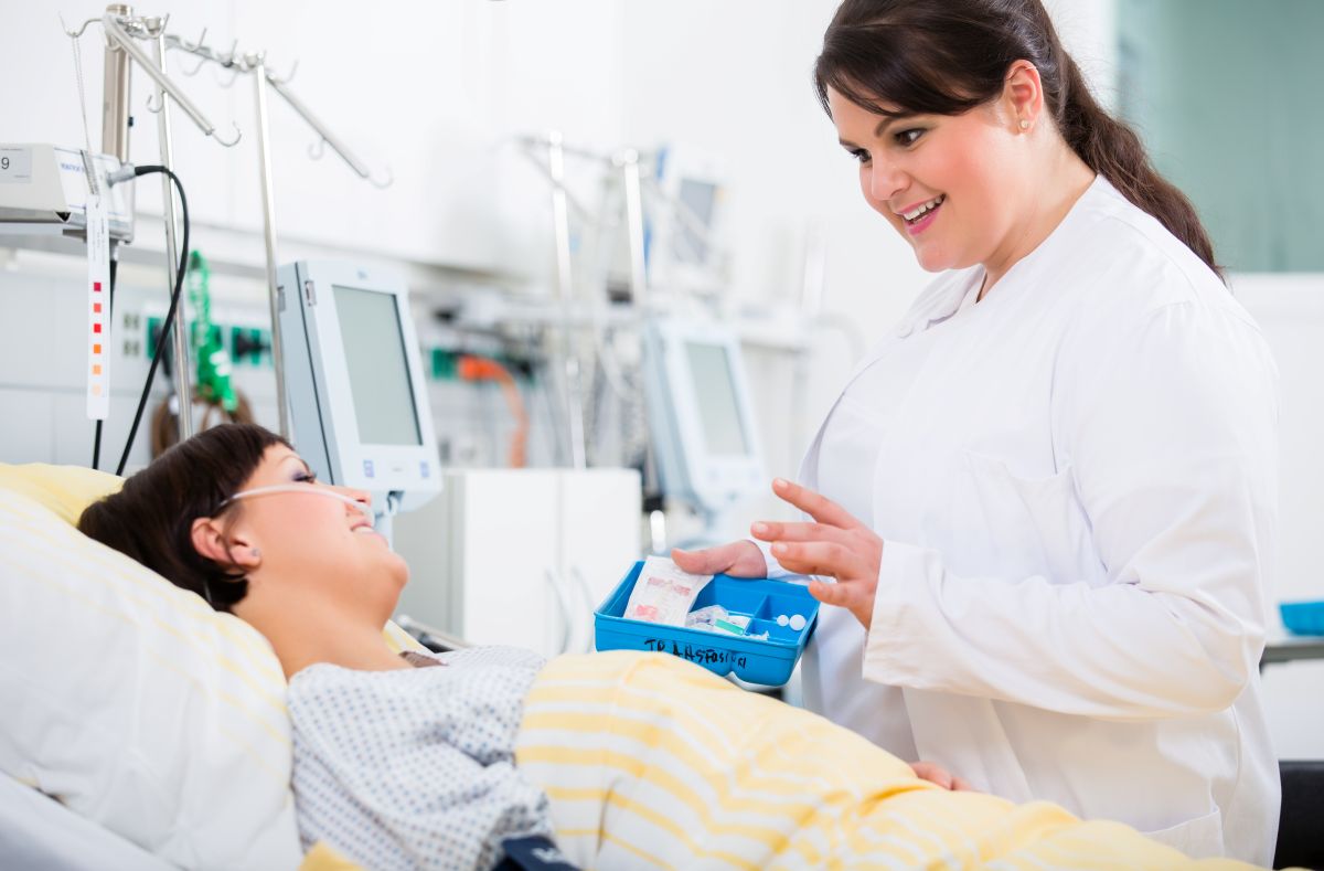 A doctor takes care of a patient who is receiving care under provisions of the CARE Act.