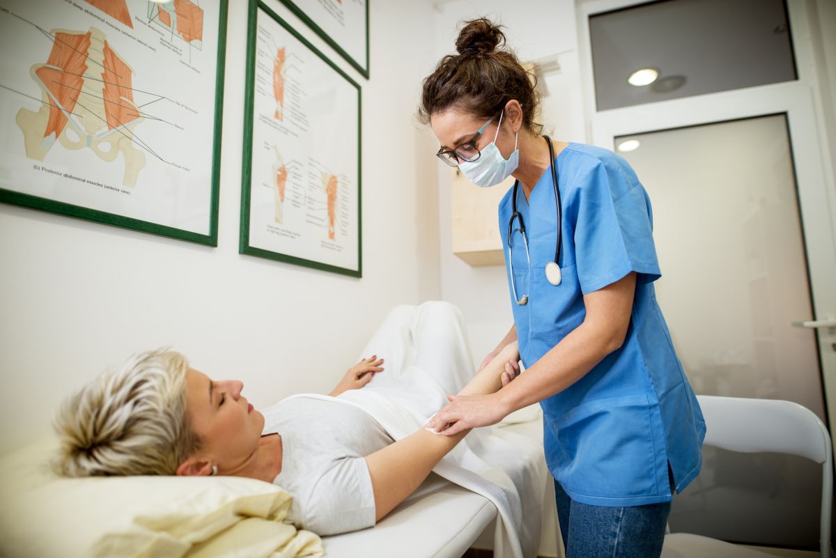 A Vermont nurse attends to a patient.