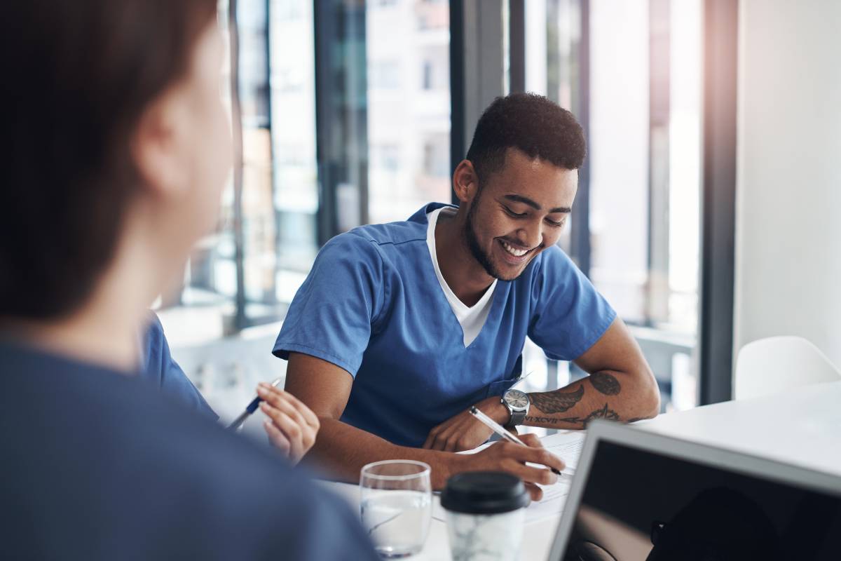 A nurse works on his Washington State nursing license renewal process.