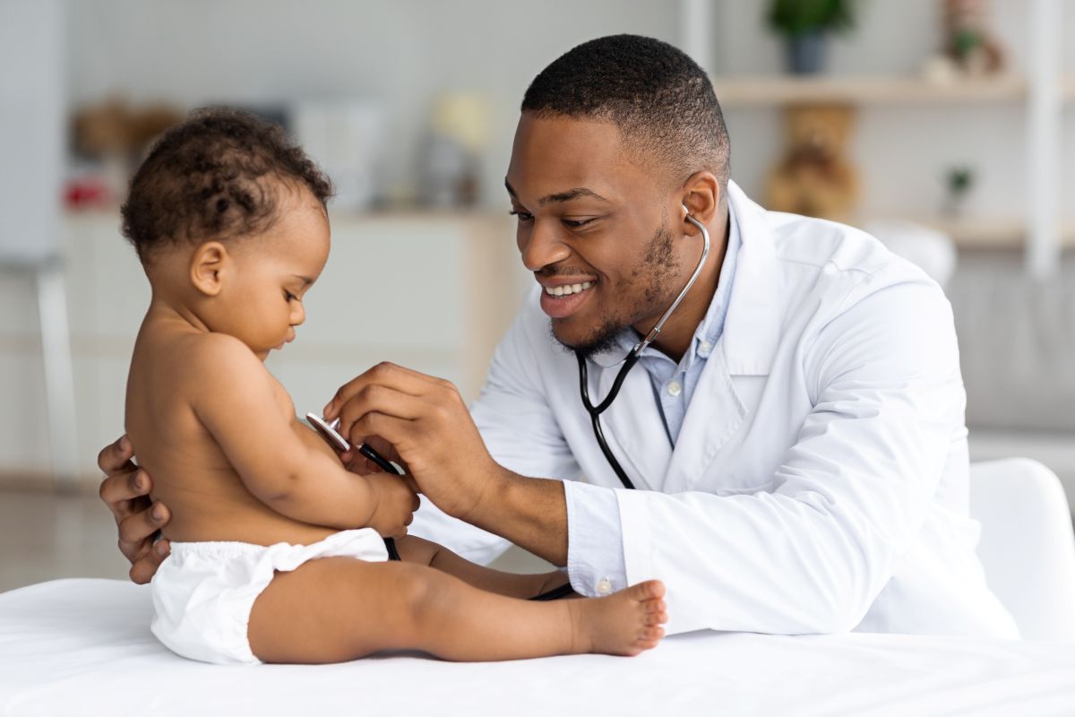 A physician in a specialty hospital examines a baby patient.