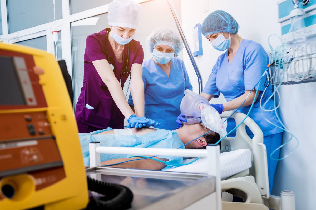 Three nurses administer CPR and demonstrate the answer to the question, What is ACLS certification?