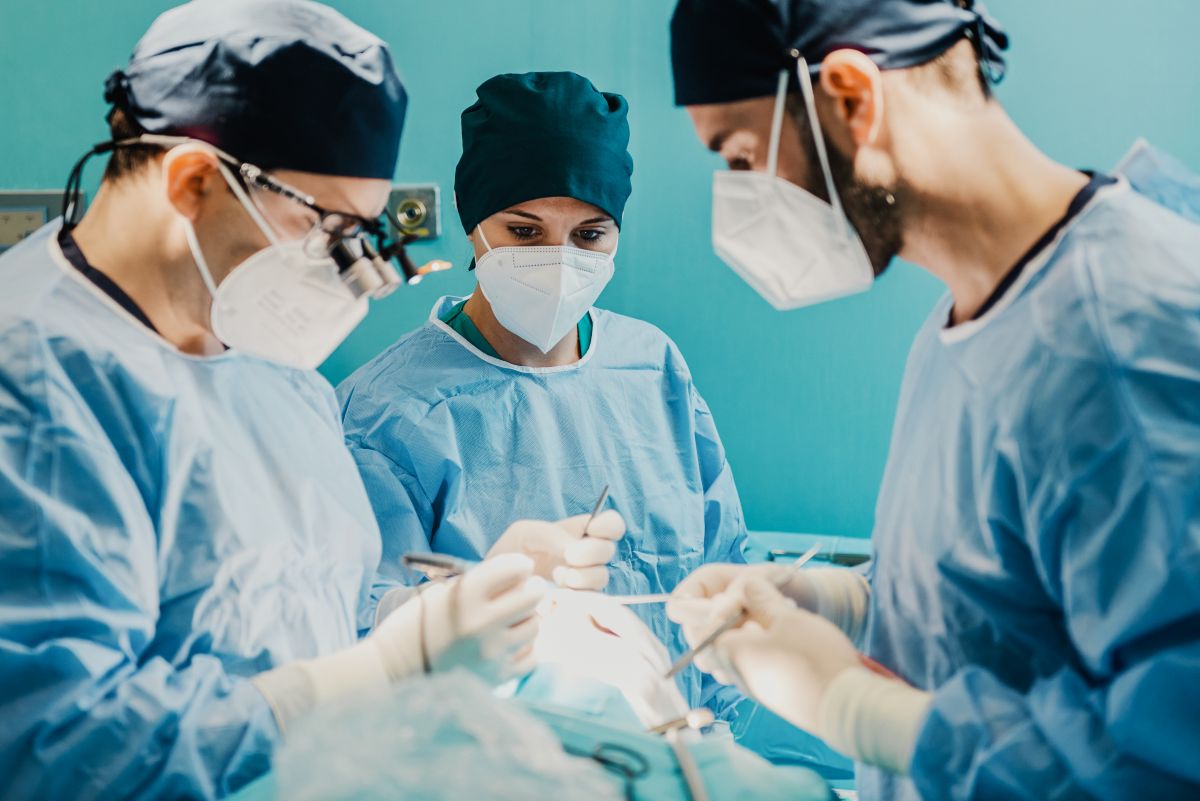 physicians operate on a patient in an ambulatory surgery center.